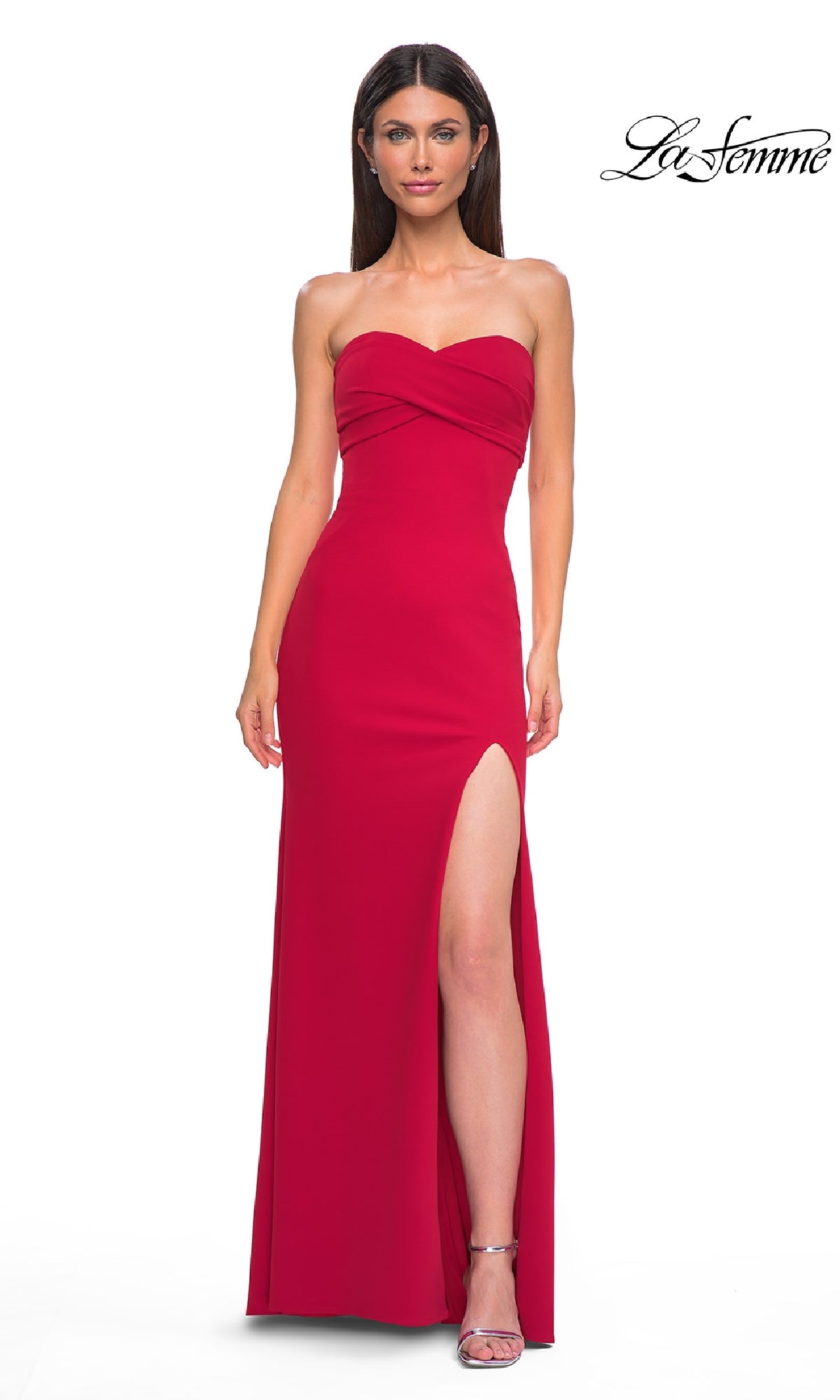 A woman wears the Strapless Sweetheart Prom Gown: La Femme 32863 with a thigh-high slit and silver high-heeled sandals. The La Femme logo appears in the top right corner.